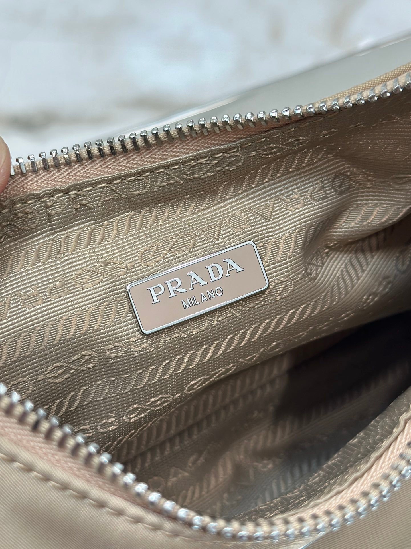 Bolsa Prada mini Re-Edition 2000