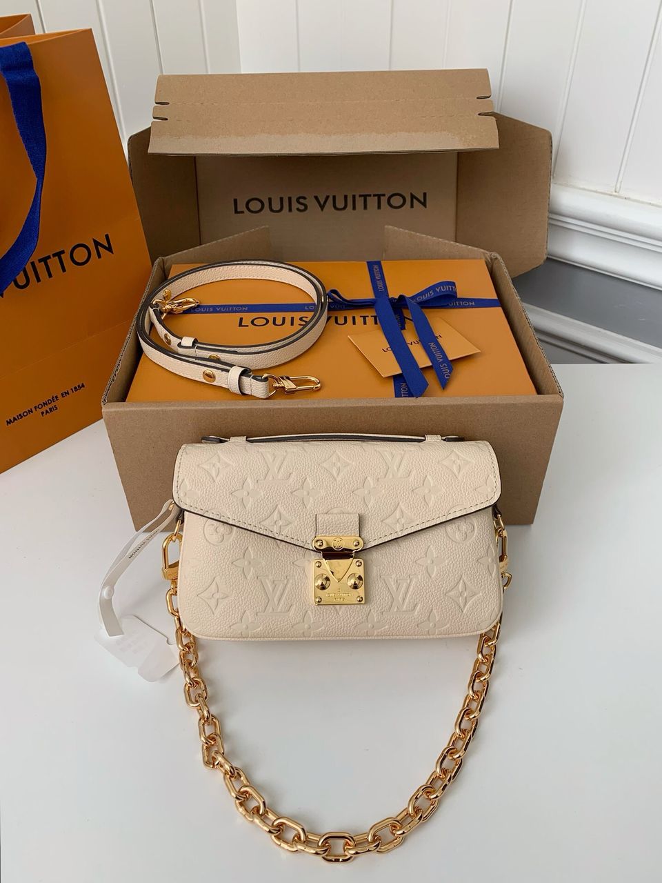 Pochette Métis East West Monogram Empreinte Cream