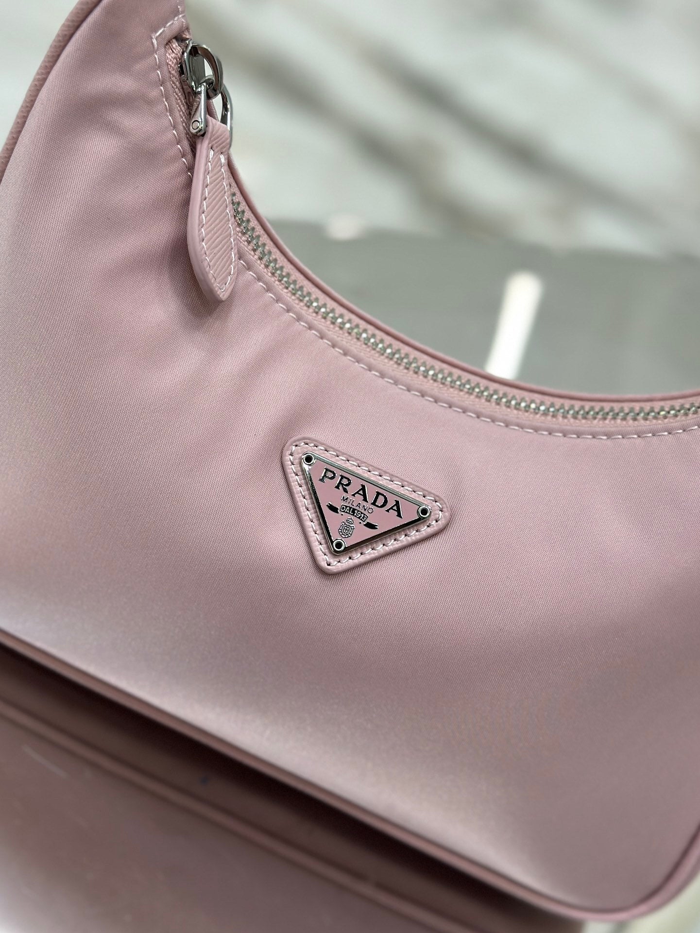 Bolsa Prada mini Re-Edition 2000